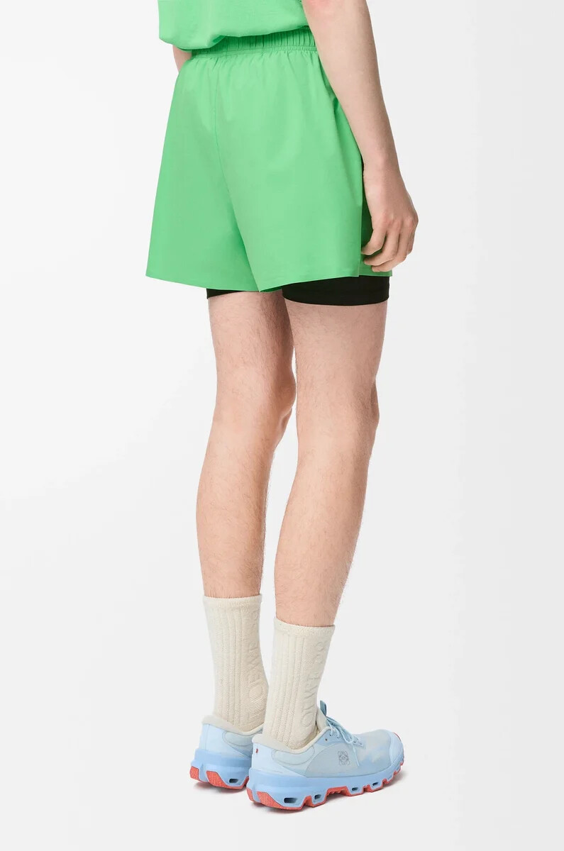 pantaloncini sportivi in shell tecnico verde